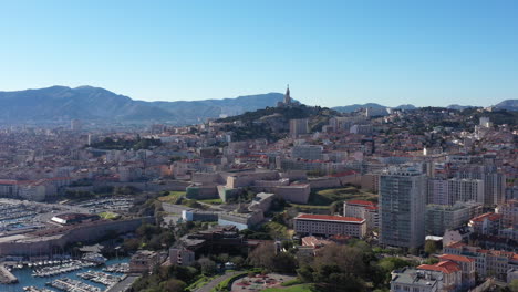Marseille-Vieux-Port-aerial-back-traveling-basilic-notre-dame-de-la-garde